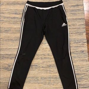 Adidas joggers with adjustable bottoms.